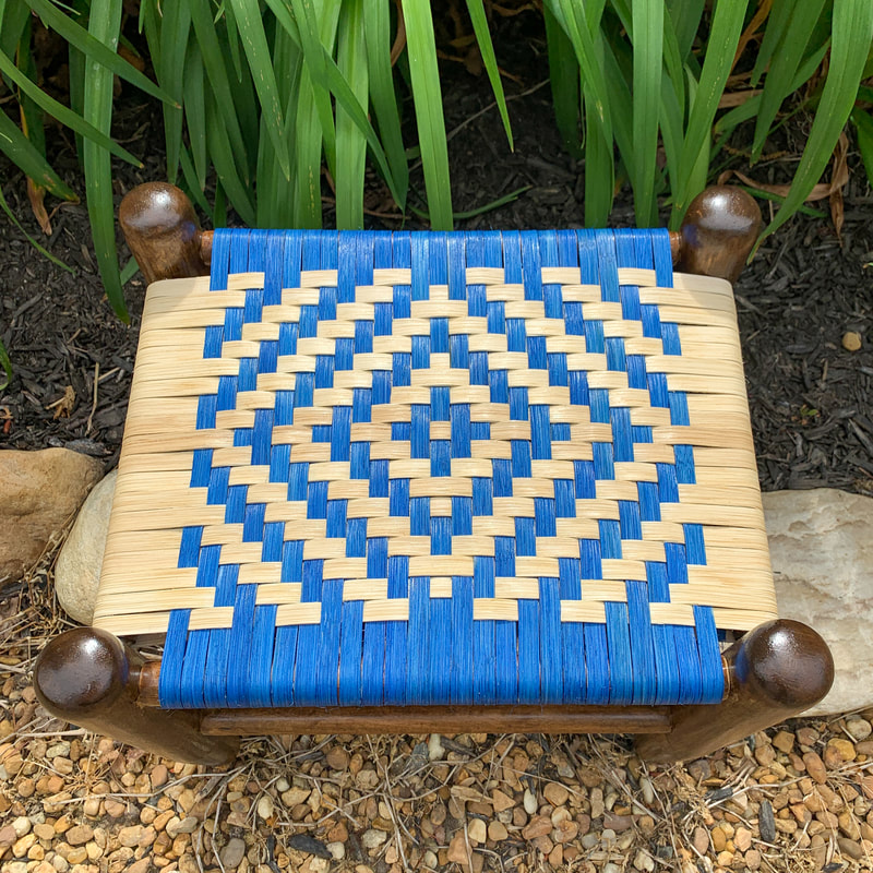 footstool with dyed flat reed in diamond pattern