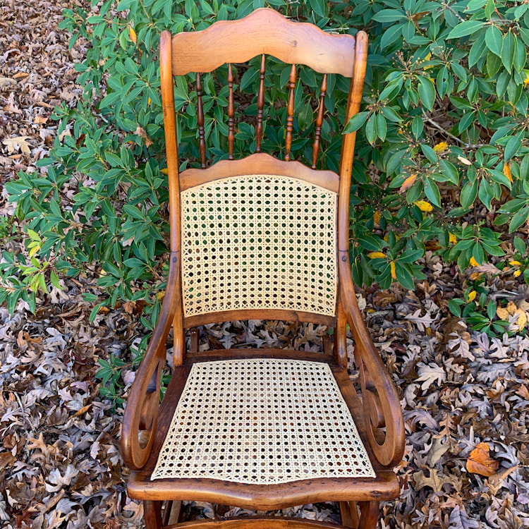rocker with hand caned seat and back