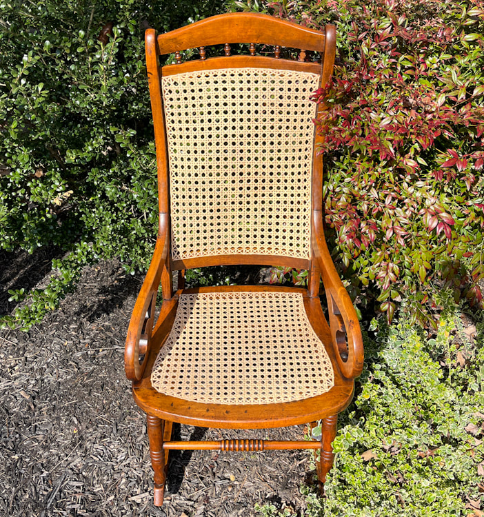 Lincoln rocker with hand caned seat and back